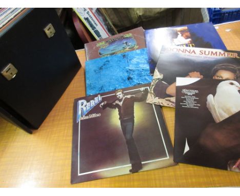 Two record cases containing a quantity of various 70's and 80's L.P.'s including Aretha Franklin, Michael Jackson, Diana Ross