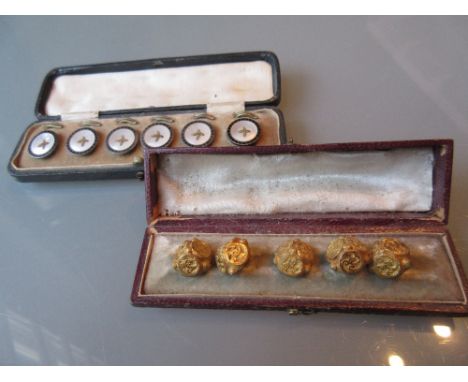 Cased set of five Victorian gilt metal dress buttons, together with a cased set of six white metal mother of pearl and black 