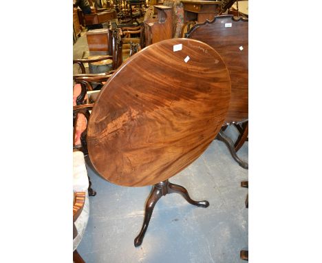 George III circular mahogany tilt top pedestal table with tripod base