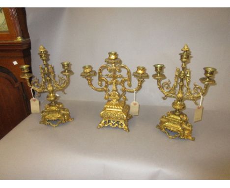 Pair of good quality late 19th or early 20th Century gilt brass three light candelabra (one a/f), together with another simil