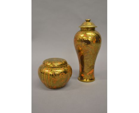 Wedgwood Fairyland jar and cover of squat baluster form decorated with elves, fairies and spiderwebs in orange enamel on a go