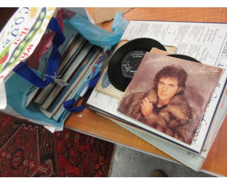 Various long playing vinyl records together with a small quantity of single vinyl records