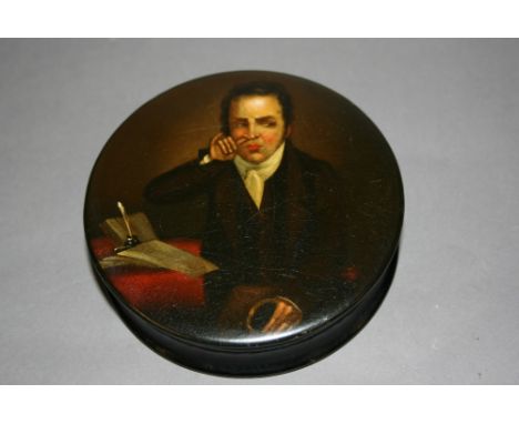 19th Century papier mache snuff box, the lid painted with a portrait of a snuff taker