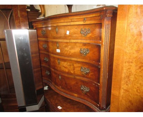 1920's Walnut serpentine fronted chest of four graduated drawers with brushing slide and brass handles raised on bracket feet