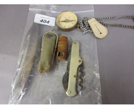 Compass, corkscrew, various razors etc