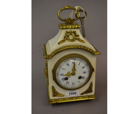 Small 19th Century French ormolu mounted white marble mantel clock, the enamel dial with Roman and Arabic numerals, with a tw