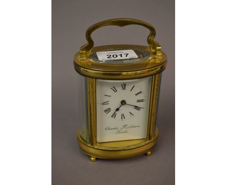 Oval brass cased carriage clock, signed Frodsham, London