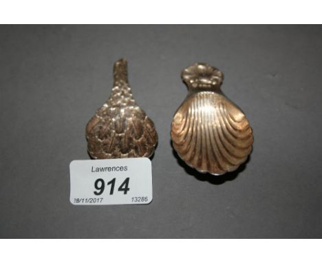 Two 20th Century silver caddy spoons in the form of a bird's wing and shell