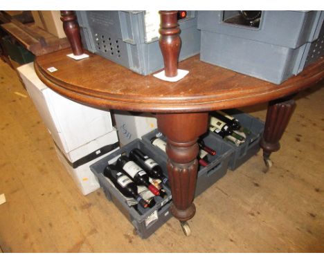 19th Century mahogany circular extending dining table, the moulded top above plain frieze with turned tapering reeded support