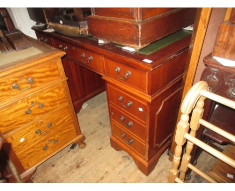 Reproduction mahogany pedestal desk having green three part leather inset top over and arrangement of nine drawers with swan 