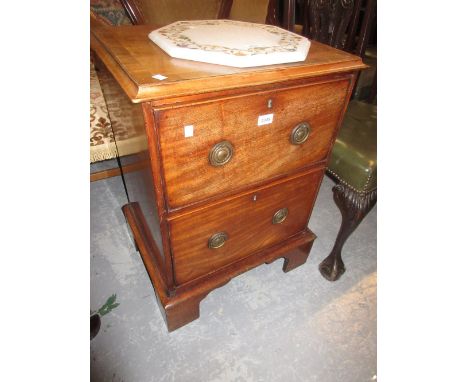 Small 19th Century mahogany two drawer chest with moulded top, brass swan neck handles and bracket feet