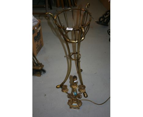 Edwardian brass jardinière stand on three splay supports together with a gilt brass and porcelain three light candelabra adap