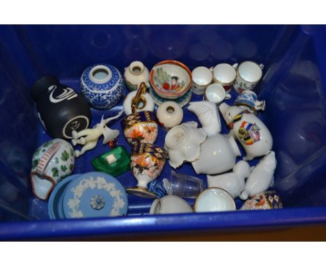 Royal Worcester miniature mug painted with a bird, together with a quantity of other miniature cups, saucers, crested porcela
