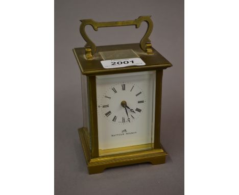 Mathew Norman, Swiss gilt brass carriage clock, the enamel dial with Roman numerals