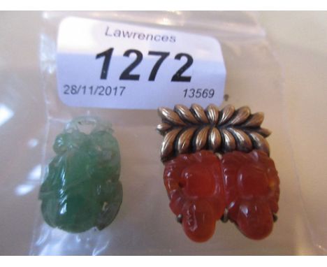 Chinese jade pendant carved in botanical form together with another pendant, carved with a figure