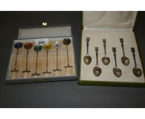 Set of six sterling silver golf motif coffee spoons with coloured enamel bowls and a set of six Continental silver coffee spo