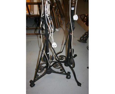 Two wrought iron lamp standards