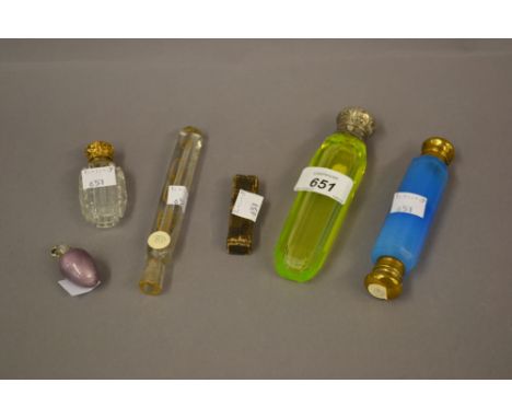 Victorian pale green glass and white metal mounted perfume bottle, a blue glass double ended scent bottle, a mauve enamel and