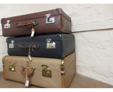 Small wooden bound and brass mounted travel trunk together with two other suitcases