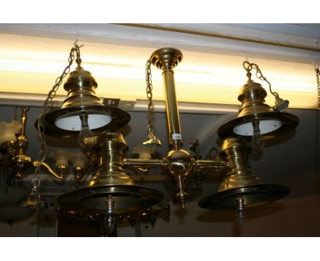Reproduction brass twin light fitting together with a pair of matching single fittings