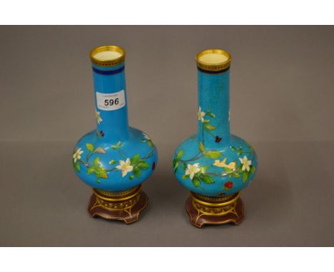 Pair of Mintons porcelain floral enamel decorated vases having pale blue ground with gilt decoration (one a/f)
