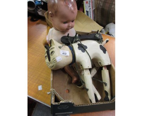 Armand Marseille composition headed doll together with a painted wooden puppet in the form of a cat