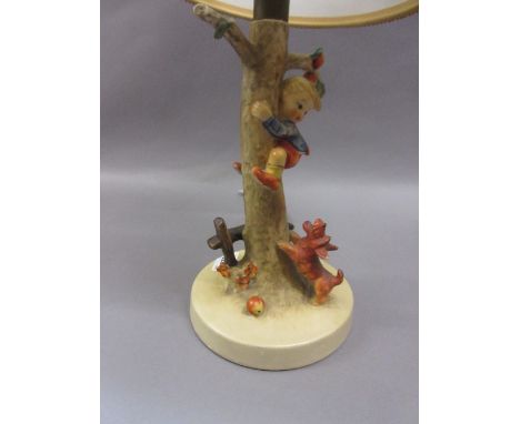 Hummell pottery table lamp in the form of a tree stump with a dog chasing a boy