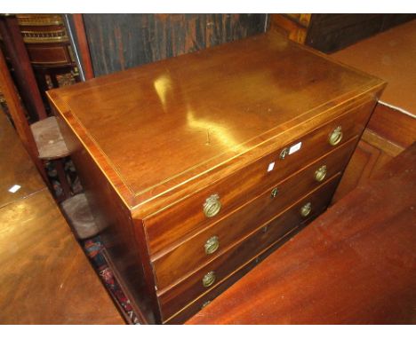Small George III mahogany boxwood and ebony line inlaid straight front chest of four graduated drawers with circular ring han