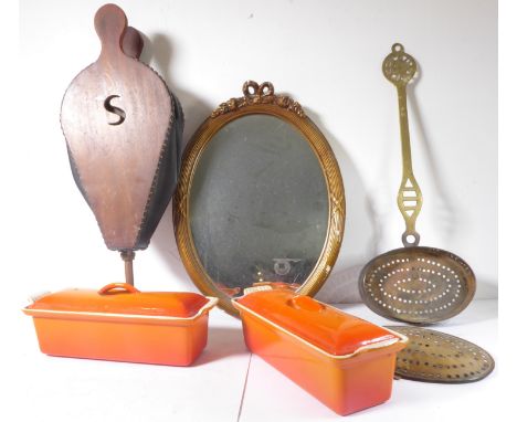 A pair of orange enamel 11" Le Creuset two-handled pâté dishes and covers, together with antique fireside bellows, brass ches