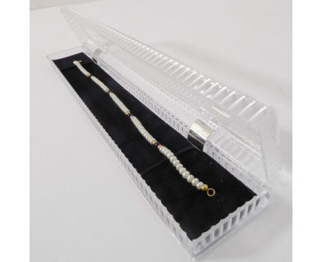 An 18-carat gold and seed-pearl bracelet (boxed)