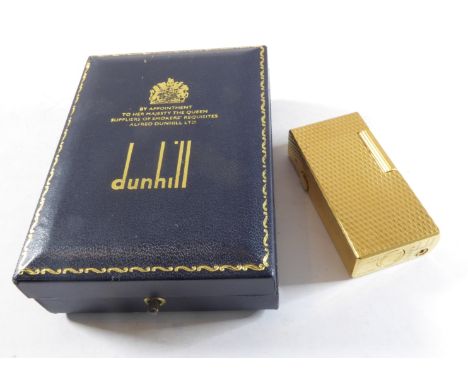 A cased Dunhill '70' gold-plated lighter (the lid of the case away from the main body)