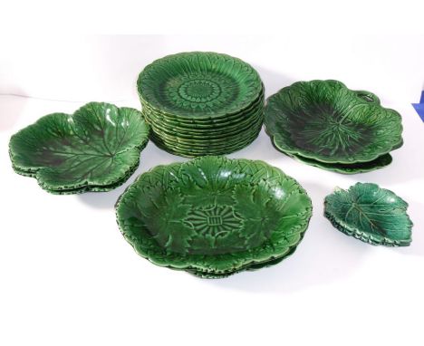 A selection of mid 19th century green glaze leaf moulded dishes by Wedgwood to include 12 circular side plates, two leaf-shap