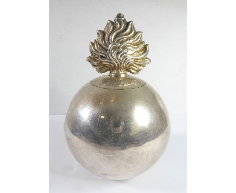 A hallmarked silver regimental table lighter in the form of a flamed grenade; the top section engraved 'Roley' belowthe risin