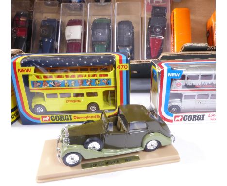 An assortment of Solido, Corgi and Breyer models:14 x Solido vintage cars in perspex cases5 x Corgi buses (2 without boxes)1 