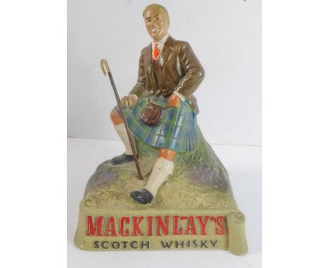 A Mackinlay's Scotch Whisky advertising figure, righthand thumb away (approx. 19cm high)