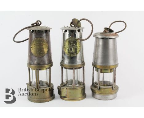 Three vintage miner's lamps, including two Eccles Type SL Protector Lamp &amp; Lighting Co and a Wolf Safety Lamp Co (William
