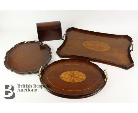 Edwardian mahogany twin-handled tea-tray, having a central shelff motif, approx 33 x 58 cms; small oval twin-handled tray wit