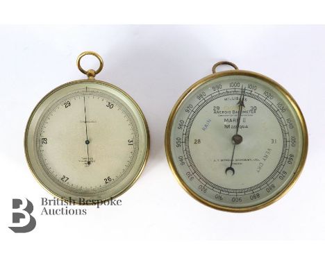 T. Wheeler Scientific Instruments compensated barometer, 2131, approx 12 cms diameter and a A.T Reynolds (Barnsbury) Ltd comp