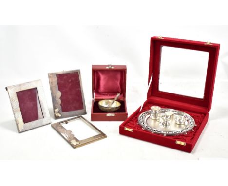 An Indian silver christening set, comprising circular tray with fixed lidded trinket and two further open pots, christening b