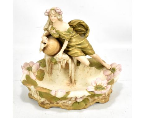 Royal Dux;&nbsp;Art Nouveau&nbsp;figure group modelled in the form of a girl resting on an urn, above semicircular floral bas