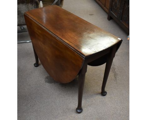 A George III red walnut drop leaf table, width 104cm.Additional InformationPlease note that this is red walnut, retains a goo