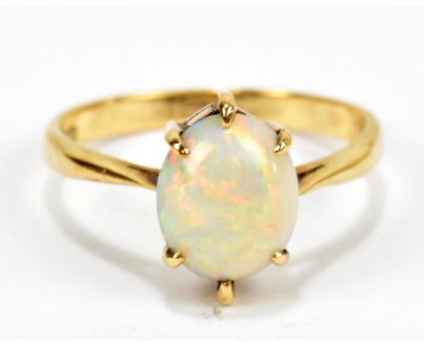 A 9ct yellow gold cabochon opal dress ring, size P, approx 2.6g.Additional InformationThe opal has light surface scratches bu