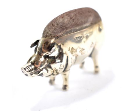 ADIE &amp; LOVEKIN LTD; an Edward VII hallmarked silver pin cushion in the form of a pig, Birmingham 1904, length 5.5cm.Addit