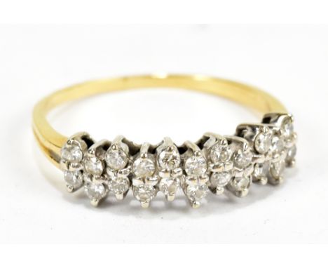 A yellow and white metal diamond ring, set with twenty-two small diamonds, the inner band stamped 18ct, size N, approx 2.7g.