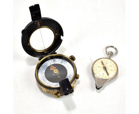 A WWI military issued Verner's patent pocket compass, with leather case, also a map distance measurer (2).