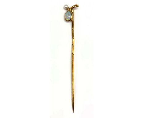 A yellow metal stick pin set with opal and cultured pearl, length 5.5cm, in Brown &amp; Son Chester box, approx 1g.