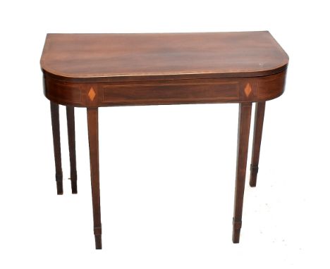 An Edwardian mahogany, inlaid and cross banded card table with replaced floral fabric playing service on tapered legs, 74 x 9