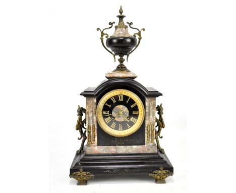 A Victorian slate and marble mantel clock having twin handled urn finial above circular dial set with Roman numerals, with me