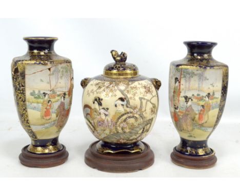 A Japanese Satsuma koro decorated with geisha to two panels and with further gilt detail throughout, the pierced lid with coc