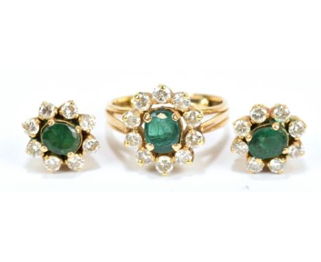 A yellow metal diamond and emerald cluster ring, size G/H, also a pair of matching clustered ear studs, combined approx 8.8g.